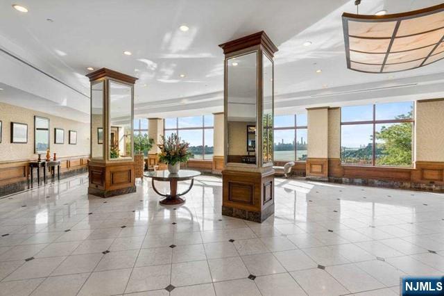 100 Old Palisade Road, Unit 1711 Fort Lee, NJ 07024 - Photo 8 of 26 a lobby with furniture and window