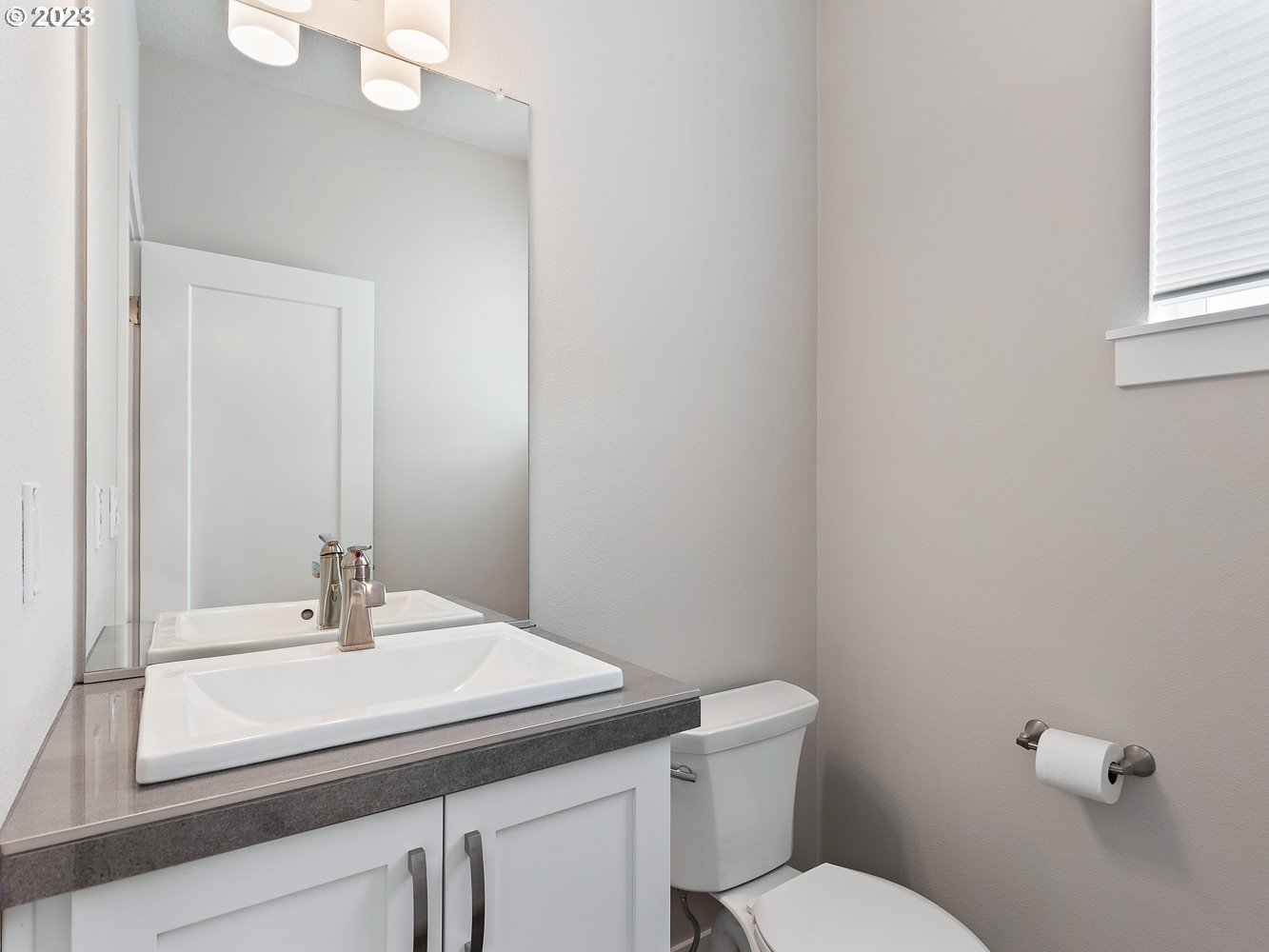 17100 Southwest Albatross Lane Beaverton, OR 97007 - Photo 33 of 48 a bathroom with a sink a toilet and mirror