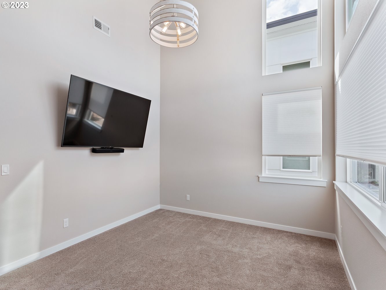 17100 Southwest Albatross Lane Beaverton, OR 97007 - Photo 37 of 48 a room with a flat screen tv and a window