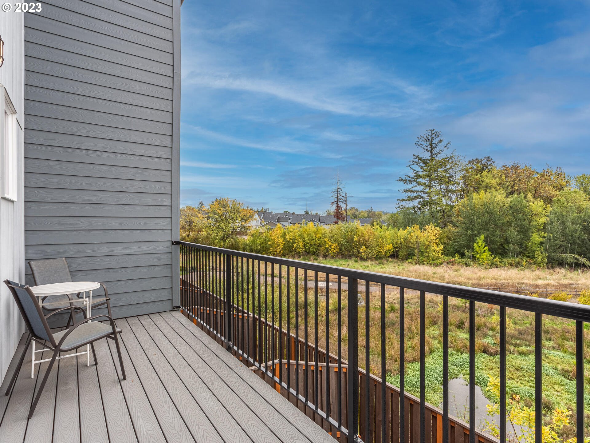 17100 Southwest Albatross Lane Beaverton, OR 97007 - Photo 41 of 48 a view of a balcony with wooden floor and fence