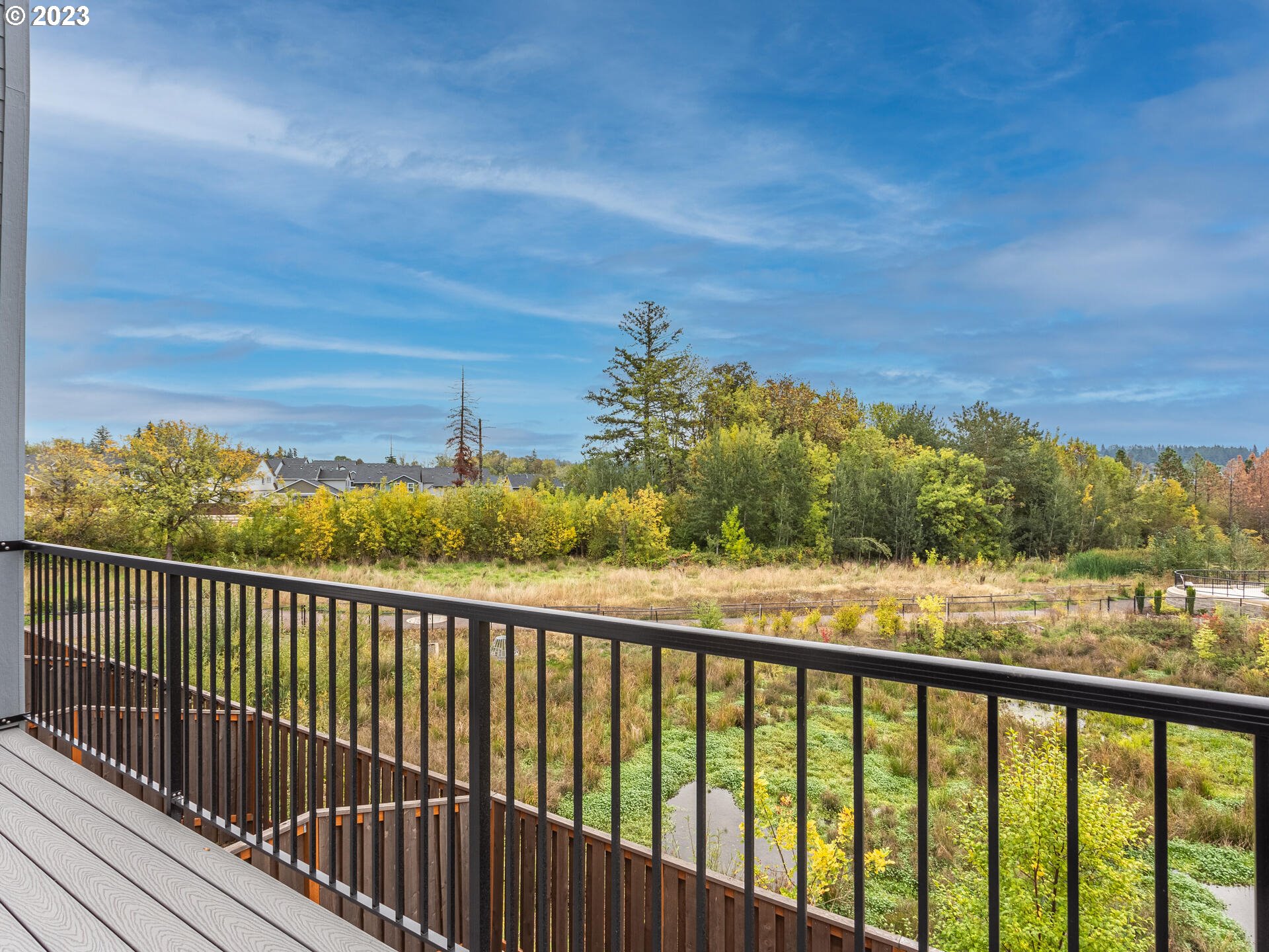 17100 Southwest Albatross Lane Beaverton, OR 97007 - Photo 42 of 48 a view of a balcony with wooden floor & fence