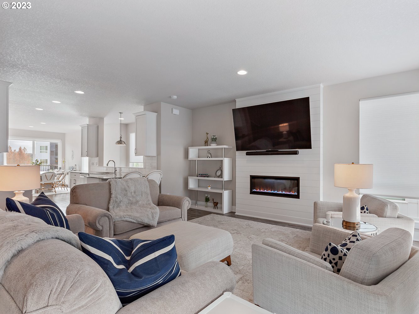 17100 Southwest Albatross Lane Beaverton, OR 97007 - Photo 10 of 48 a living room with furniture a flat screen tv and a fireplace