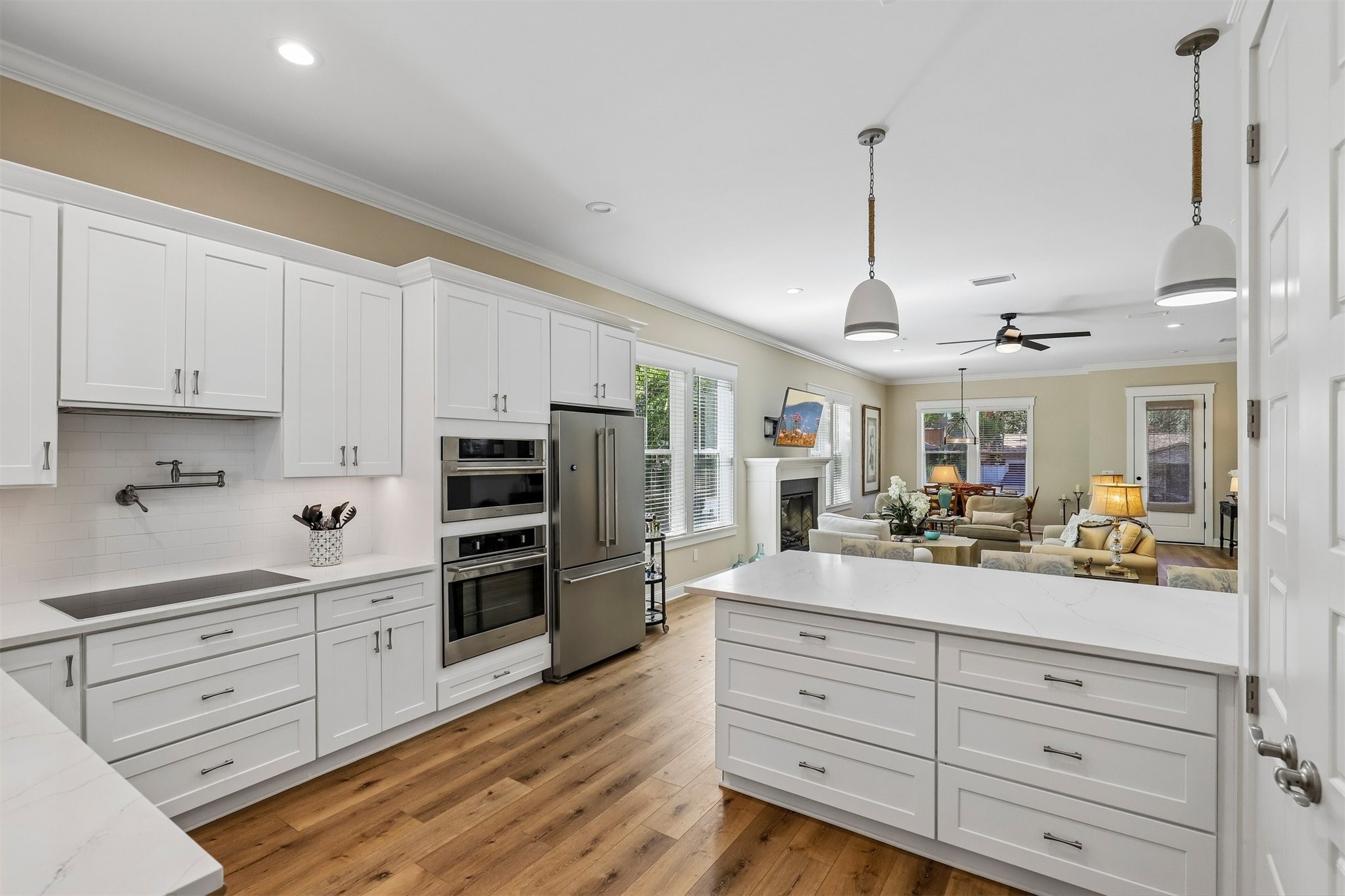 1012 White Street Fernandina Beach, FL 32034 - Photo 17 of 35 a kitchen with stainless steel appliances kitchen island granite countertop a refrigerator and cabinets