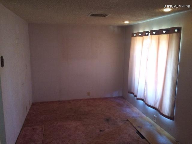 331 North Pima Benson, AZ 85602 - Photo 7 of 7 an empty room with a empty space and windows