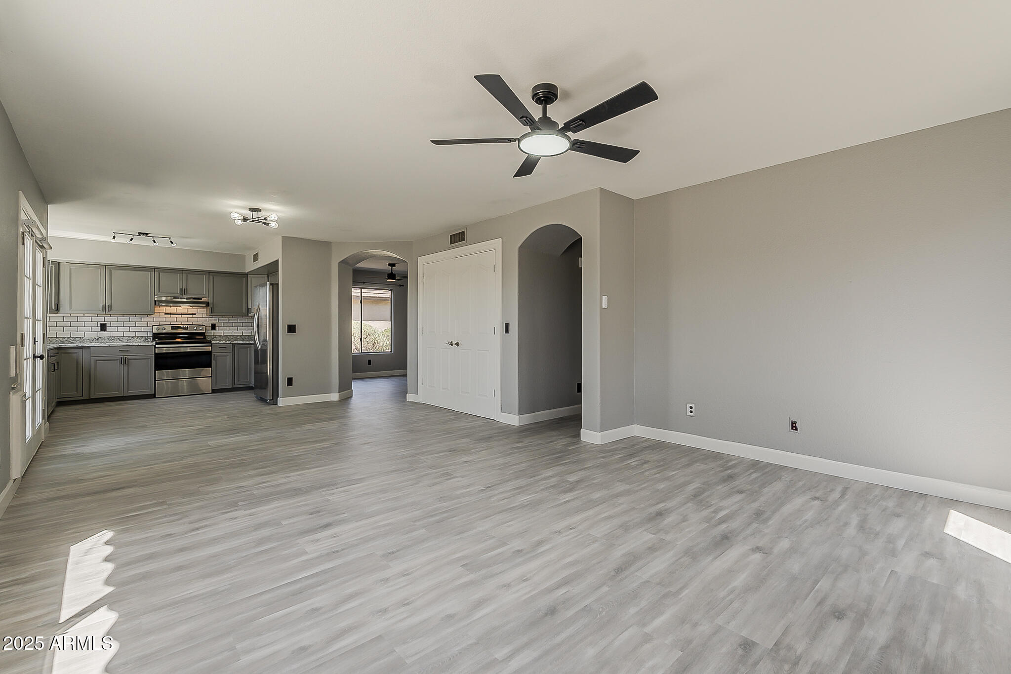 21928 North Braden Road Maricopa, AZ 85138 - Photo 14 of 58 a view of an empty room with a window