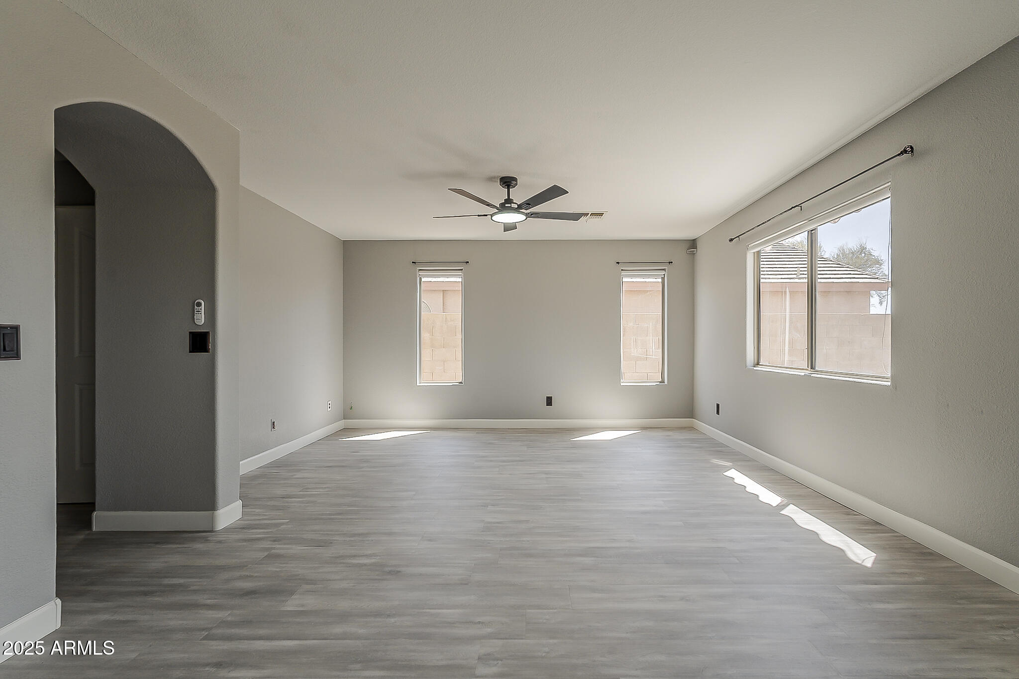 21928 North Braden Road Maricopa, AZ 85138 - Photo 17 of 58 a view of an empty room with a window