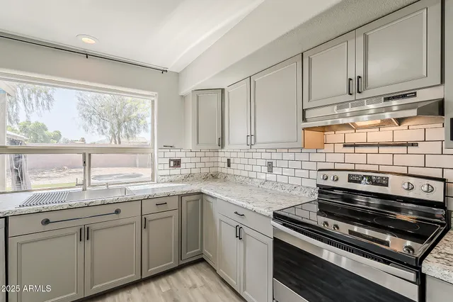a bathroom with a sink a mirror and vanity