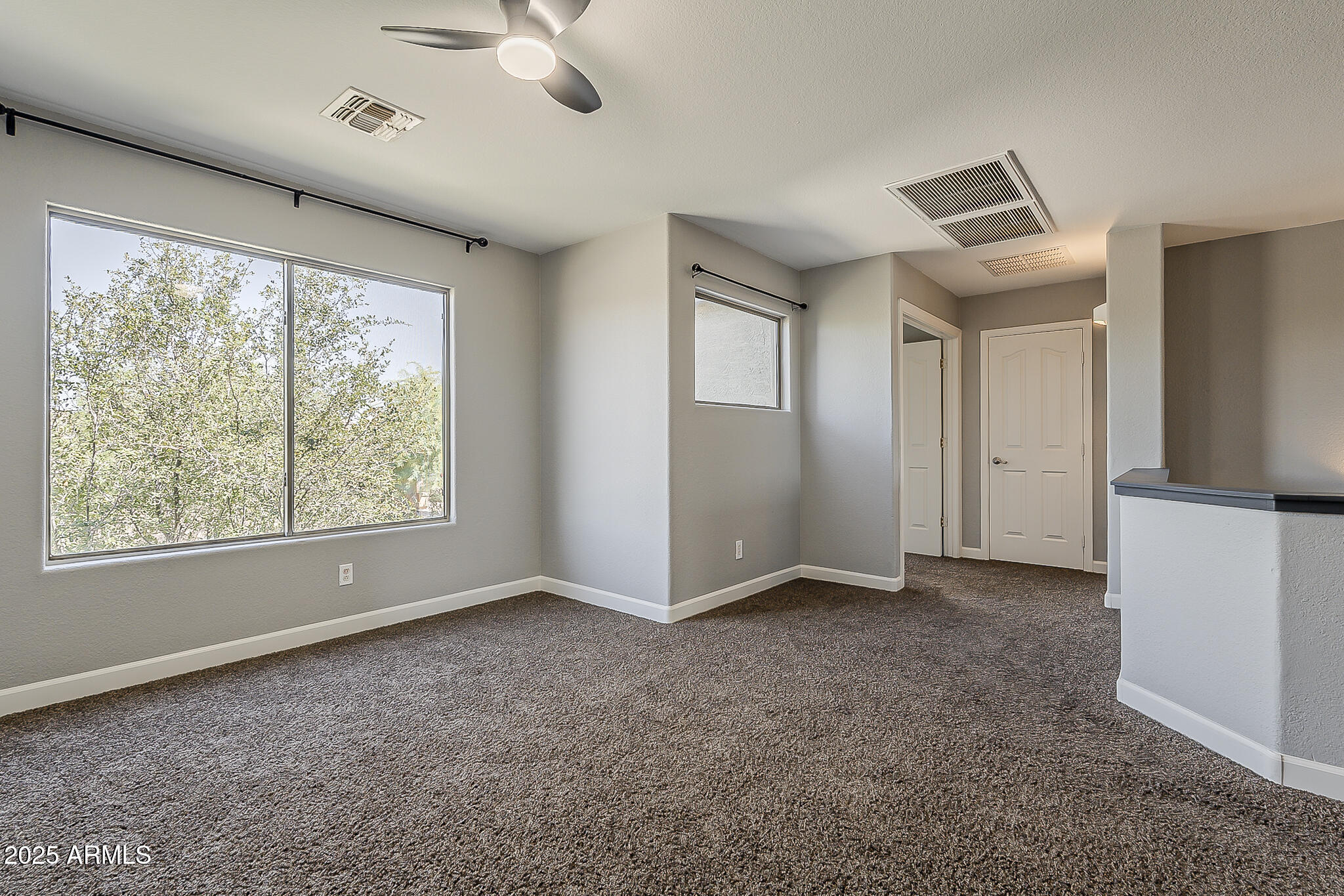 21928 North Braden Road Maricopa, AZ 85138 - Photo 27 of 58 a view of an empty room with a window