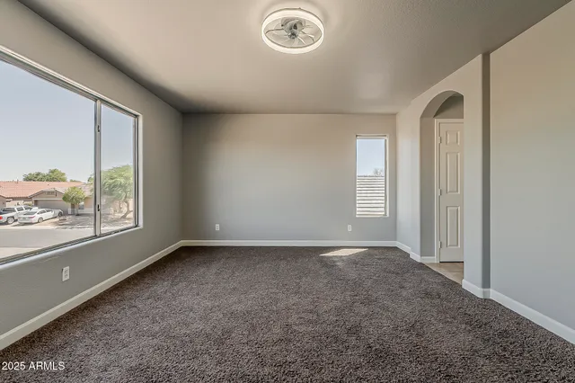 a bathroom with a sink a light fixture and a mirror