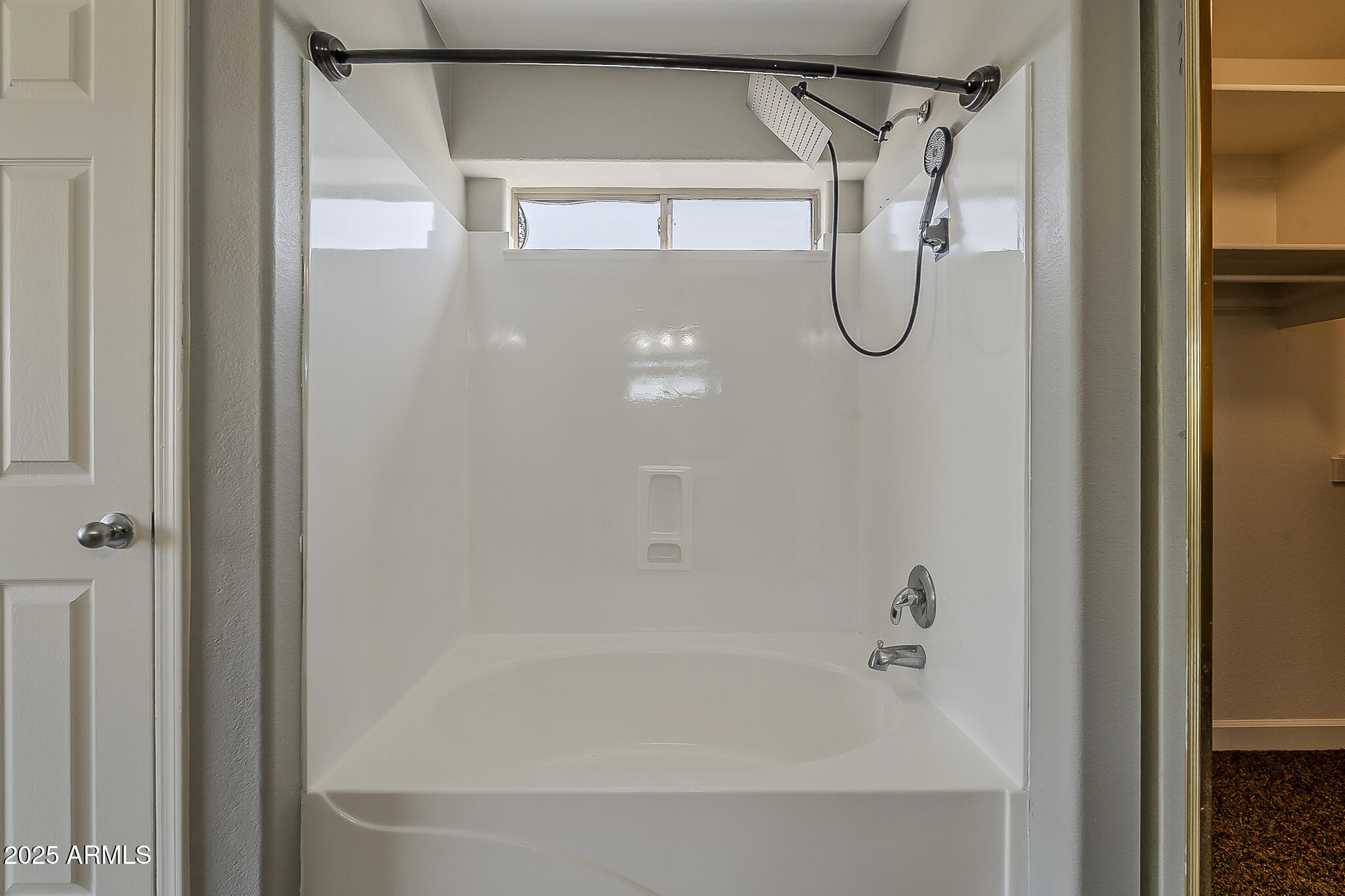 21928 North Braden Road Maricopa, AZ 85138 - Photo 45 of 58 a bathroom with a glass shower door