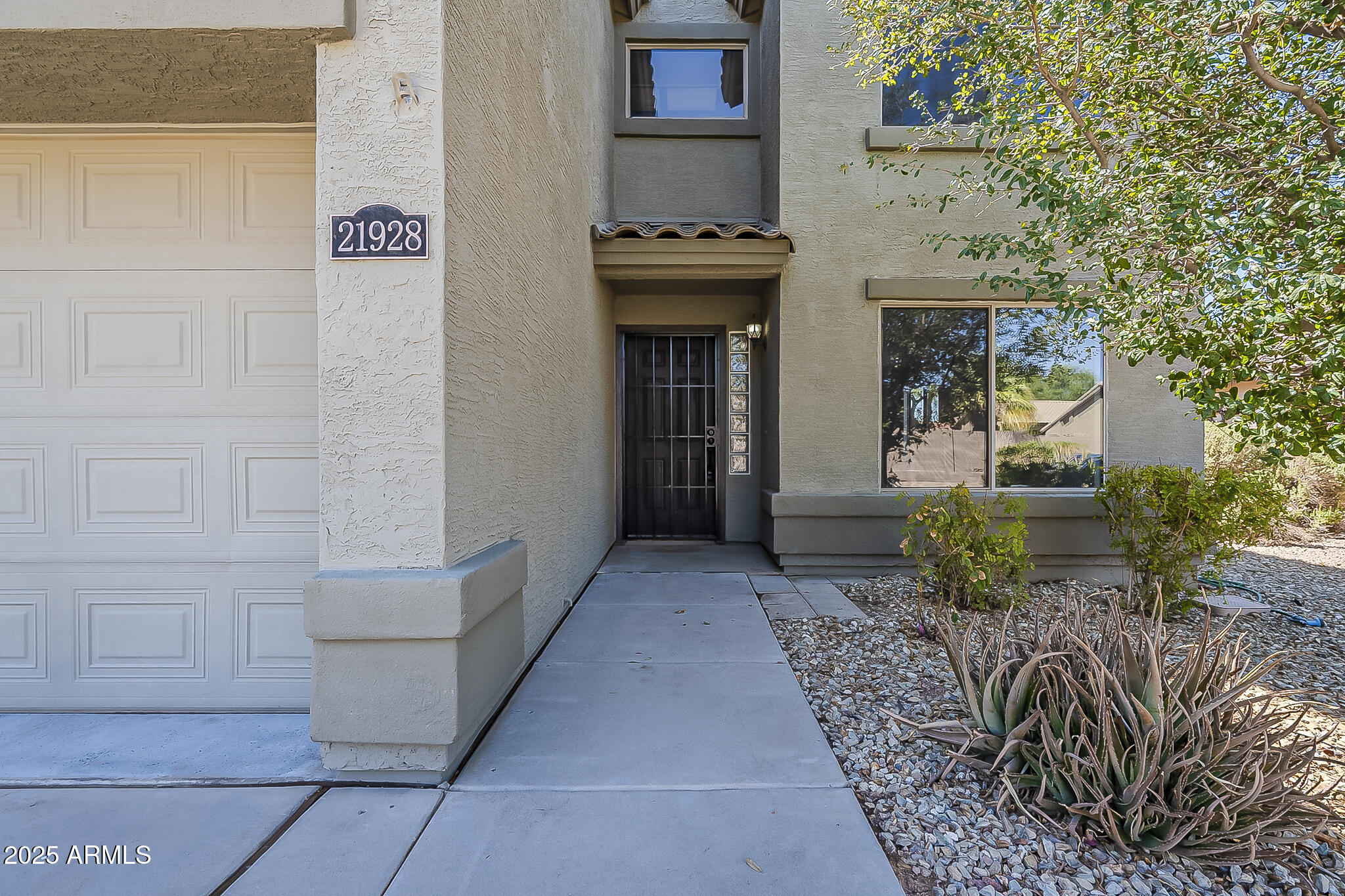 21928 North Braden Road Maricopa, AZ 85138 - Photo 5 of 58 a front view of a house with entryway