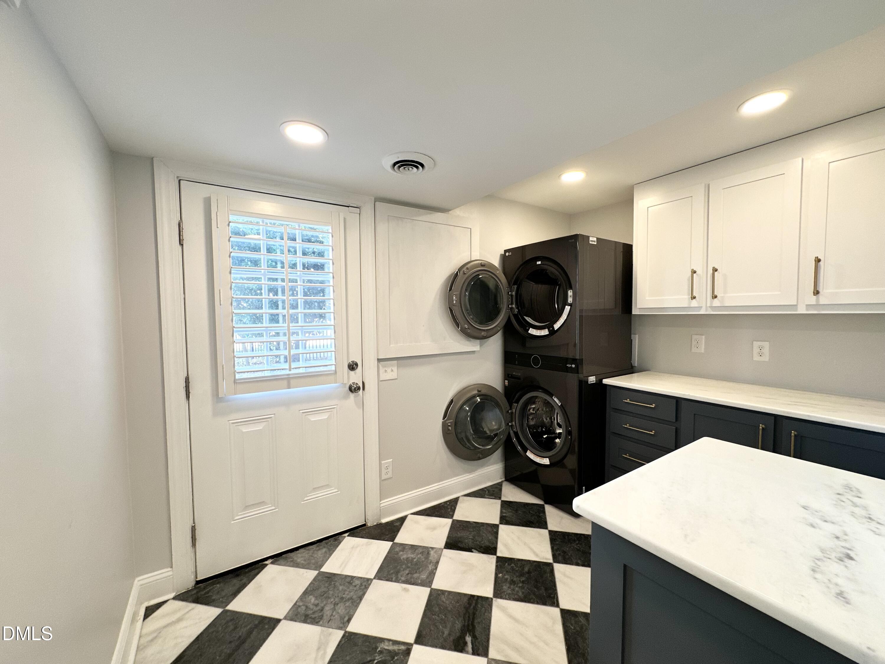 4512 Drexel Drive Raleigh, NC 27609 - Photo 14 of 36 a kitchen with a refrigerator a stove and a sink