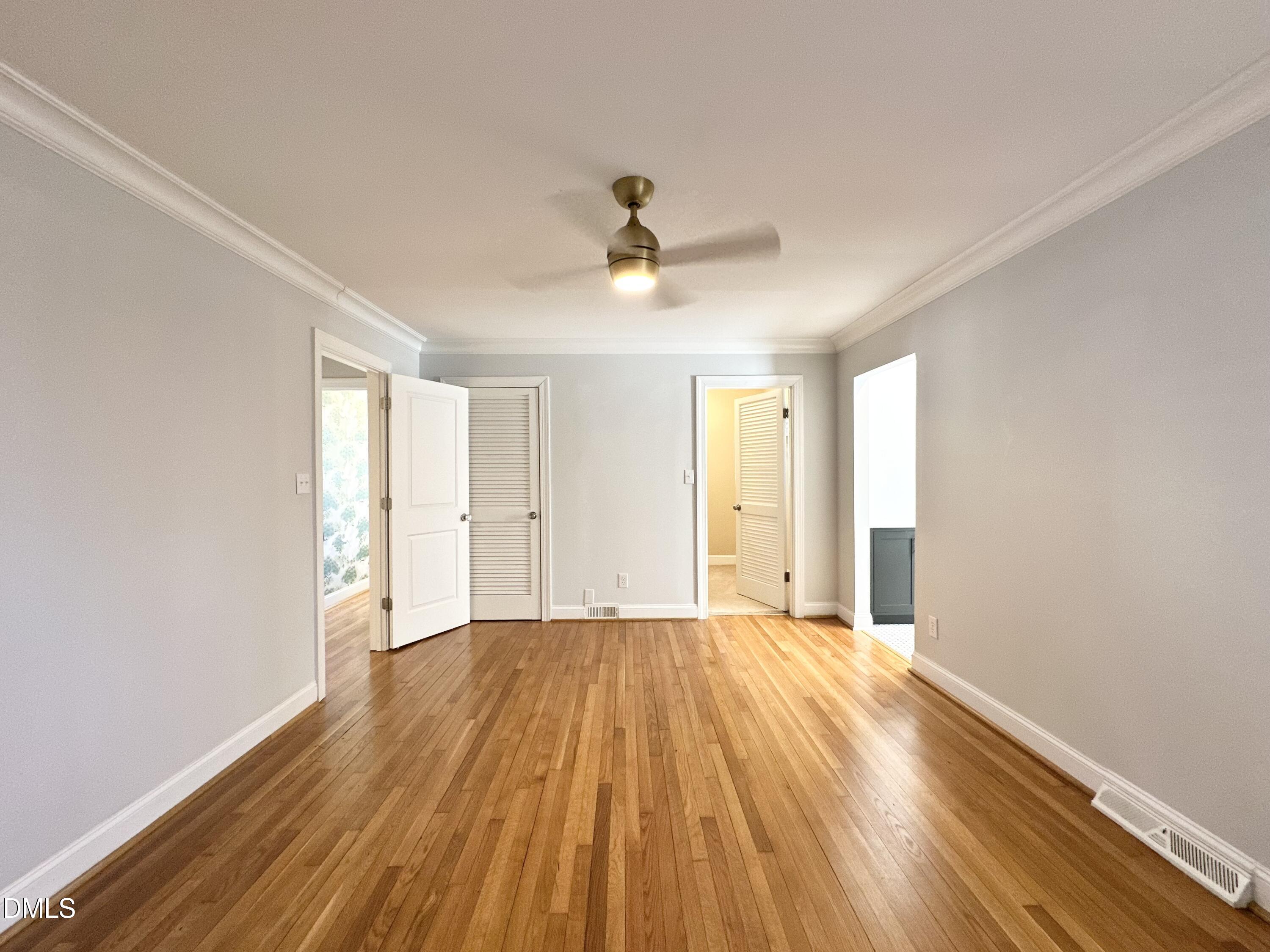 4512 Drexel Drive Raleigh, NC 27609 - Photo 23 of 36 a view of a room with wooden floor and ceiling fan