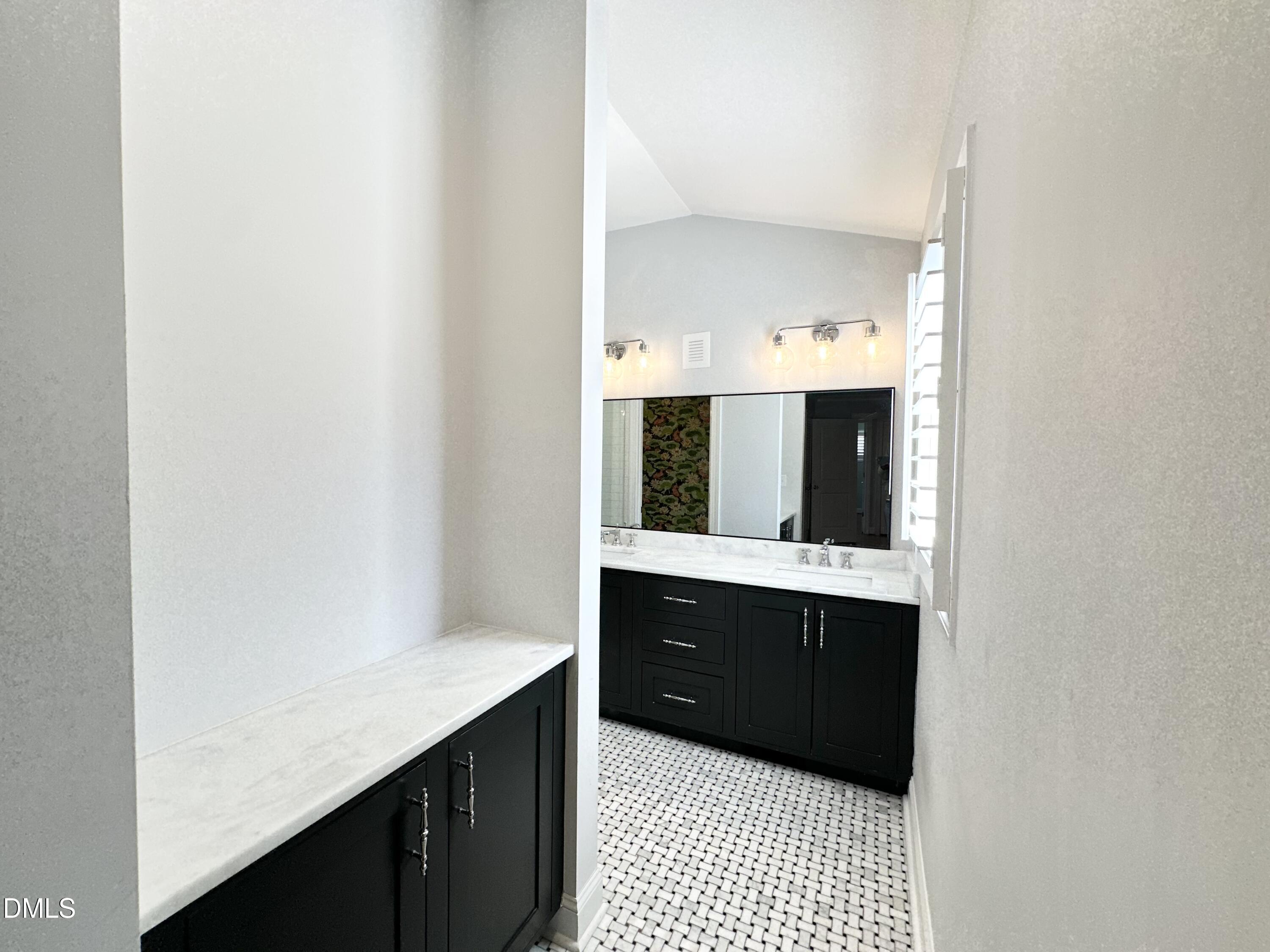 4512 Drexel Drive Raleigh, NC 27609 - Photo 24 of 36 a bathroom with a sink and a mirror