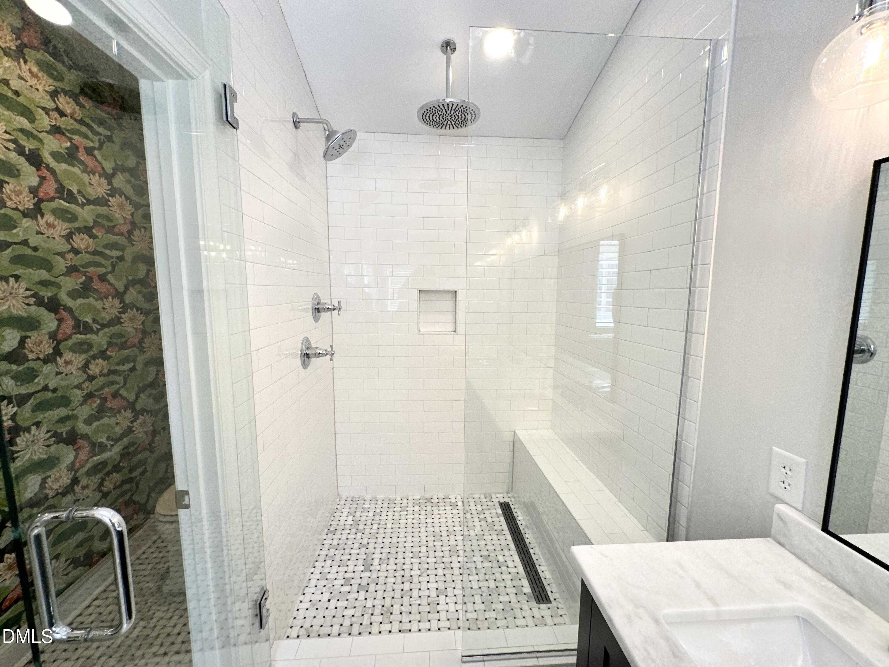 4512 Drexel Drive Raleigh, NC 27609 - Photo 26 of 36 a bathroom with a sink a toilet a shower and a mirror