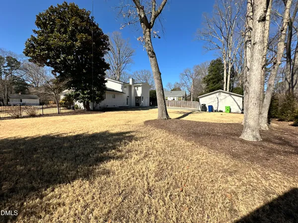 a view of a yard with a tree
