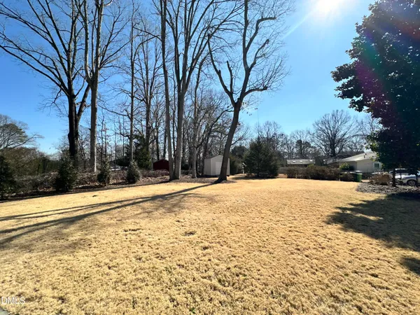 a house with trees in the background