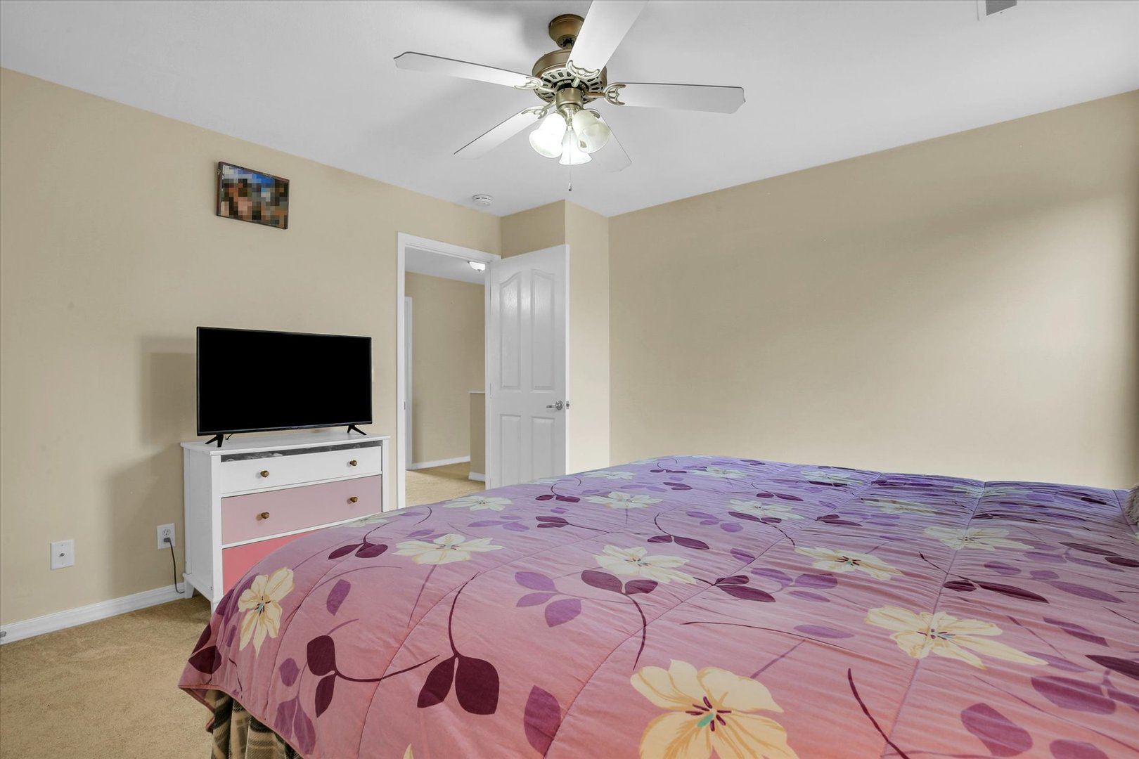 3715 Boulder Ridge Drive Champaign, IL 61822 - Photo 21 of 29 a bedroom with a bed and a flat screen tv