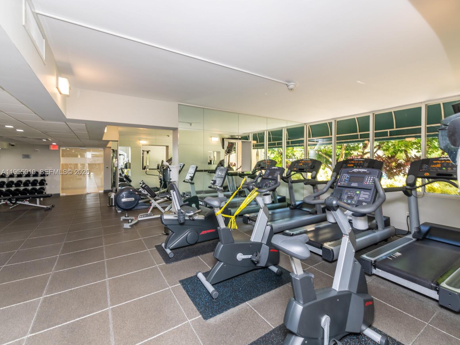 888 Brickell Key Drive, Unit 210 Miami, FL 33131 - Photo 67 of 84 a view of a room with gym equipment