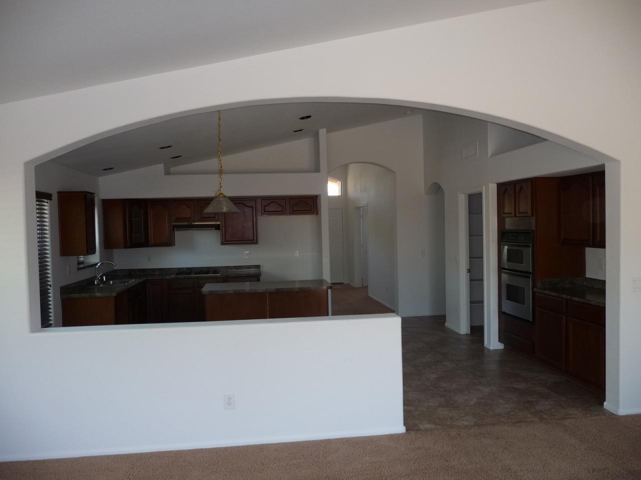 2202 West Roy Rogers Road Phoenix, AZ 85085 - Photo 4 of 17 KITCHEN FROM FAM ROOM