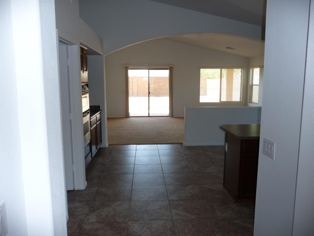 2202 West Roy Rogers Road Phoenix, AZ 85085 - Photo 8 of 17 LOOKING FROM KITCH TO FAM RM
