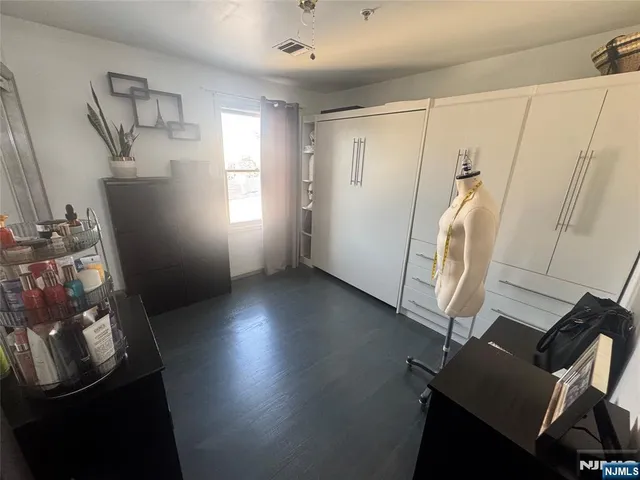 a view of a livingroom with furniture and a window