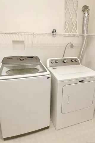 a utility room with dryer and washer