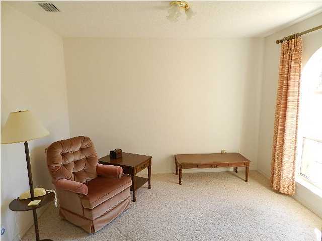 2388 Cove Road Navarre, FL 32566 - Photo 6 of 32 a living room with furniture and a window