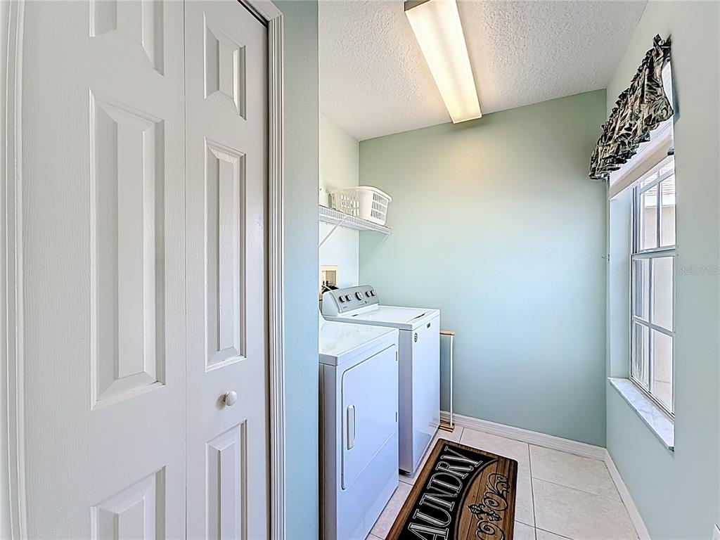 11117 Kapok Grand Circle Madeira Beach, FL 33708 - Photo 28 of 62 a view of an entryway with furniture