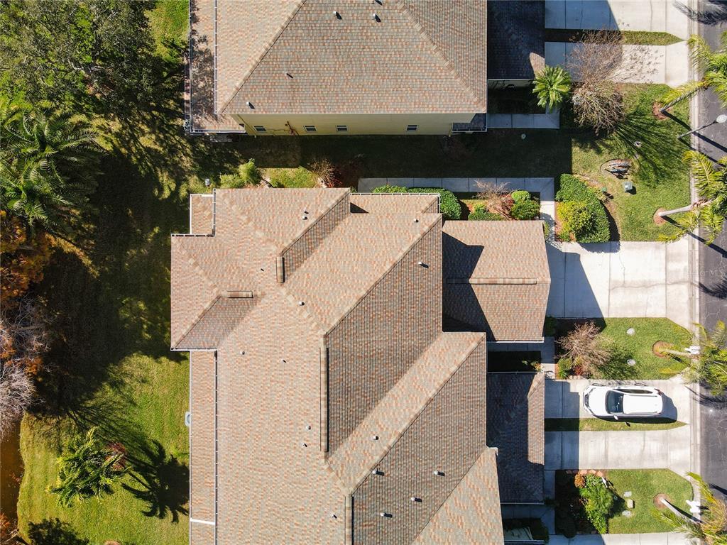 11117 Kapok Grand Circle Madeira Beach, FL 33708 - Photo 44 of 62 an aerial view of a house with a yard