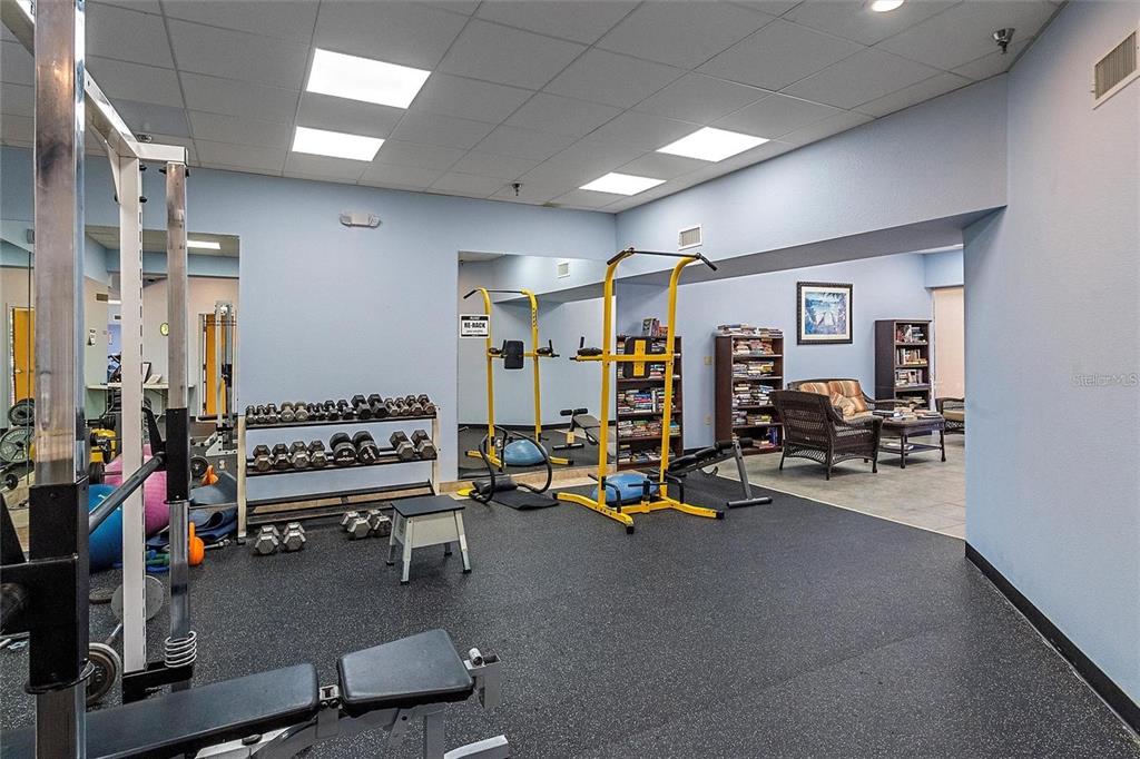 11117 Kapok Grand Circle Madeira Beach, FL 33708 - Photo 45 of 62 a view of a room with gym equipment