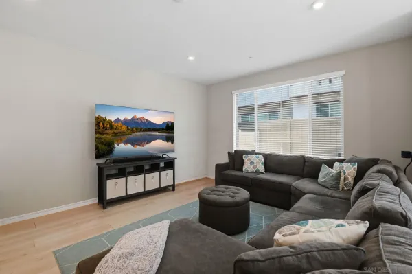 a bathroom with a tub double sink window and mirror