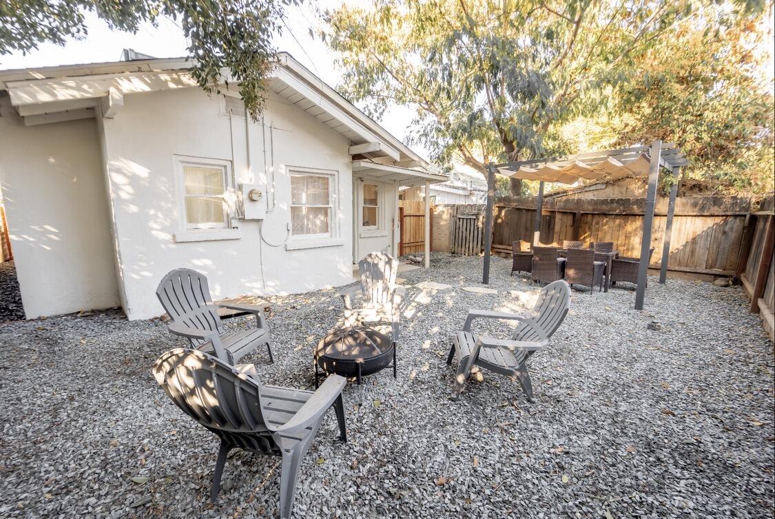 232 Ash Street Exeter, CA 93221 - Photo 5 of 13 a view of a patio with couple of chairs in front of house