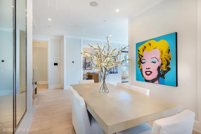 a living room with furniture and a painting