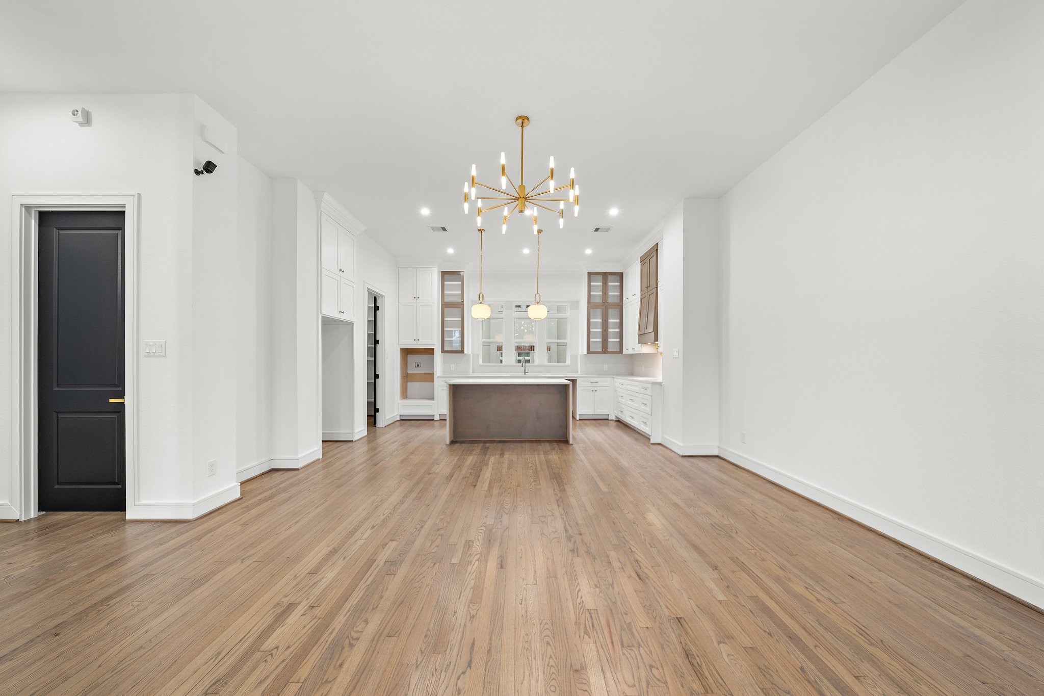 1013 East 28th Street Houston, TX 77009 - Photo 14 of 38 a view of a kitchen with wooden floor and a large window