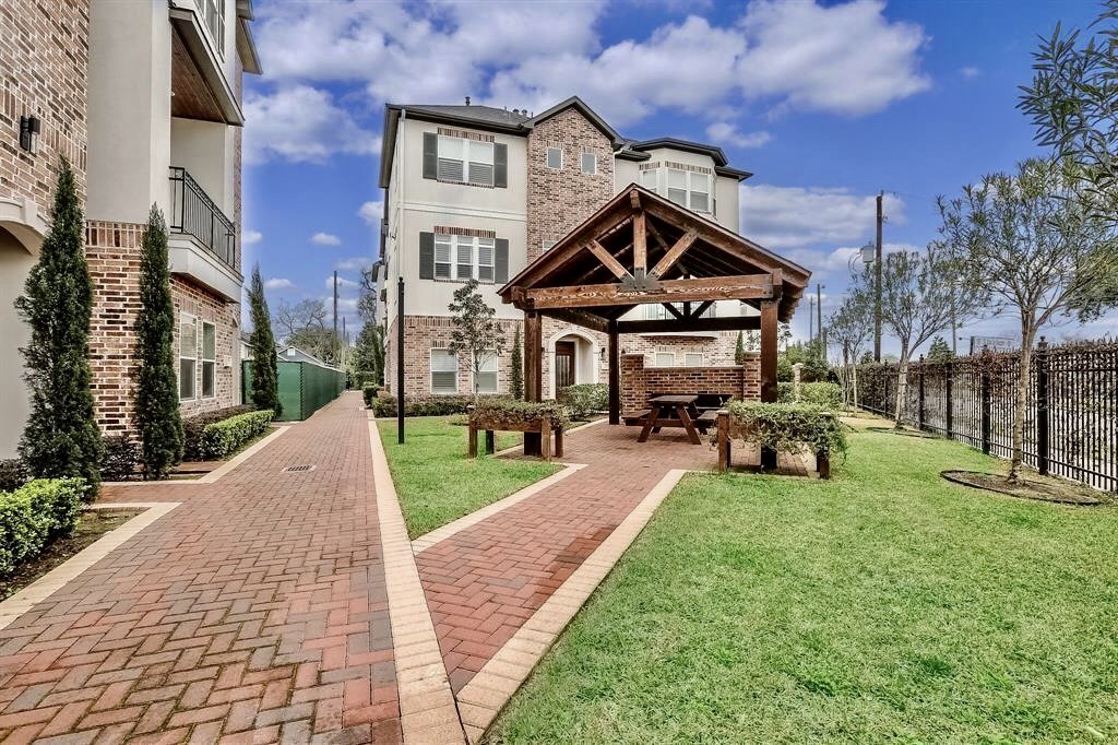 1013 East 28th Street Houston, TX 77009 - Photo 2 of 38 a view of a big yard with table and chairs