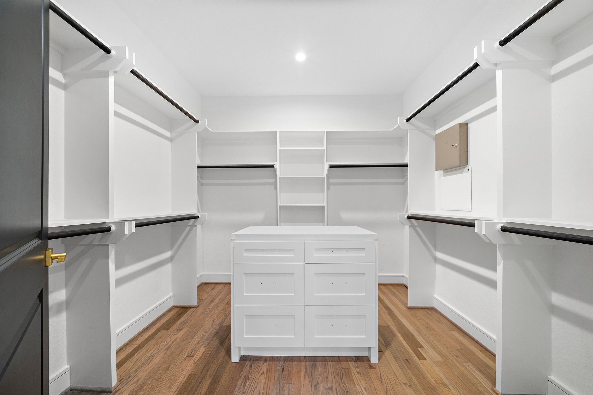 1013 East 28th Street Houston, TX 77009 - Photo 24 of 38 a view of walk in closet with empty racks