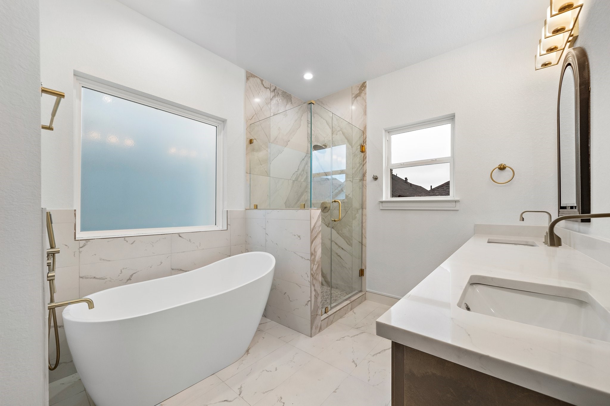 1013 East 28th Street Houston, TX 77009 - Photo 25 of 38 a bathroom with a white tub shower vanity and sink