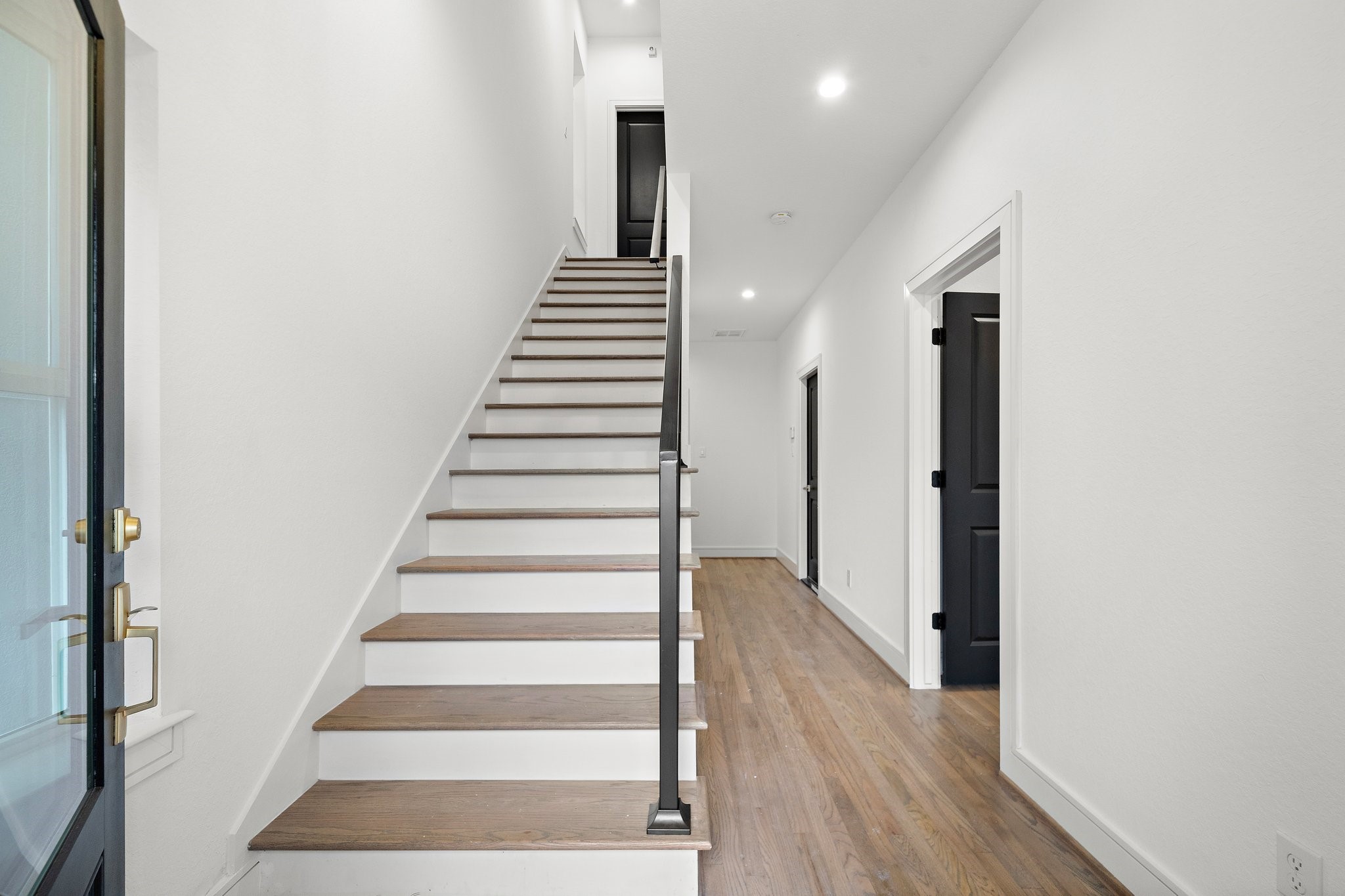 1013 East 28th Street Houston, TX 77009 - Photo 4 of 38 a view of entryway and hall with wooden floor
