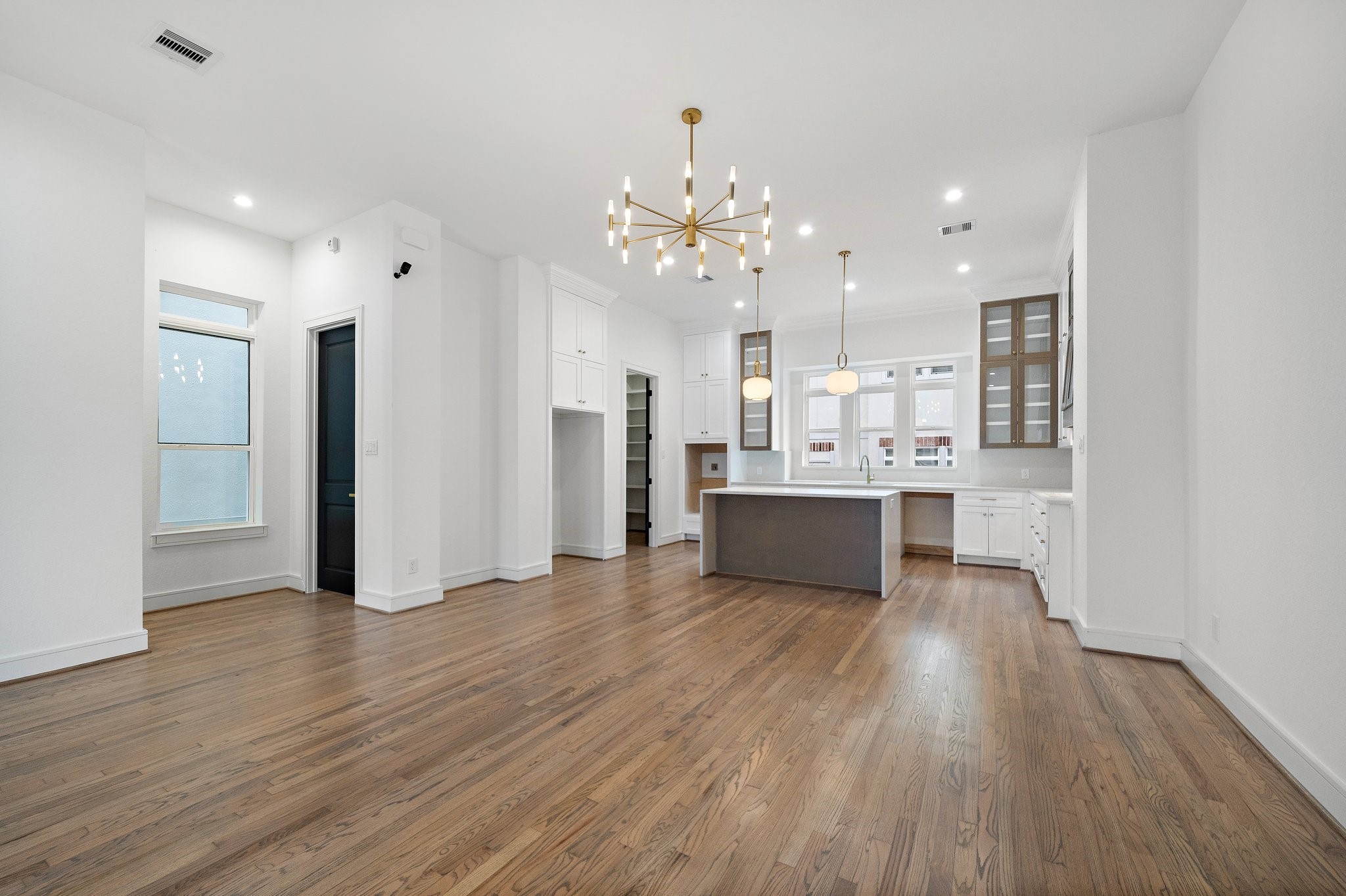 1013 East 28th Street Houston, TX 77009 - Photo 7 of 38 a view of a kitchen with wooden floor and a kitchen