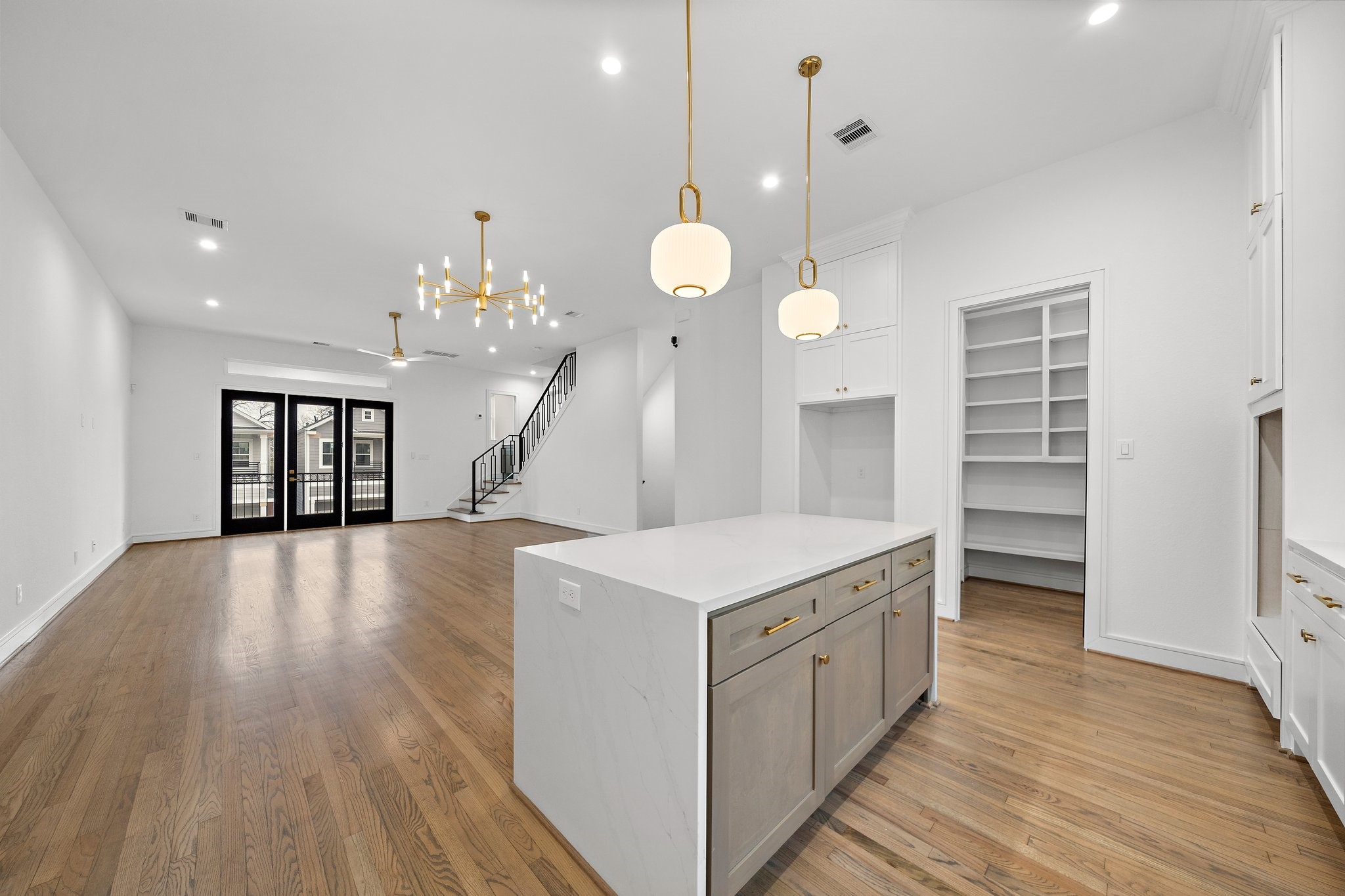 1013 East 28th Street Houston, TX 77009 - Photo 9 of 38 a kitchen that has a lot of cabinets and wooden floor