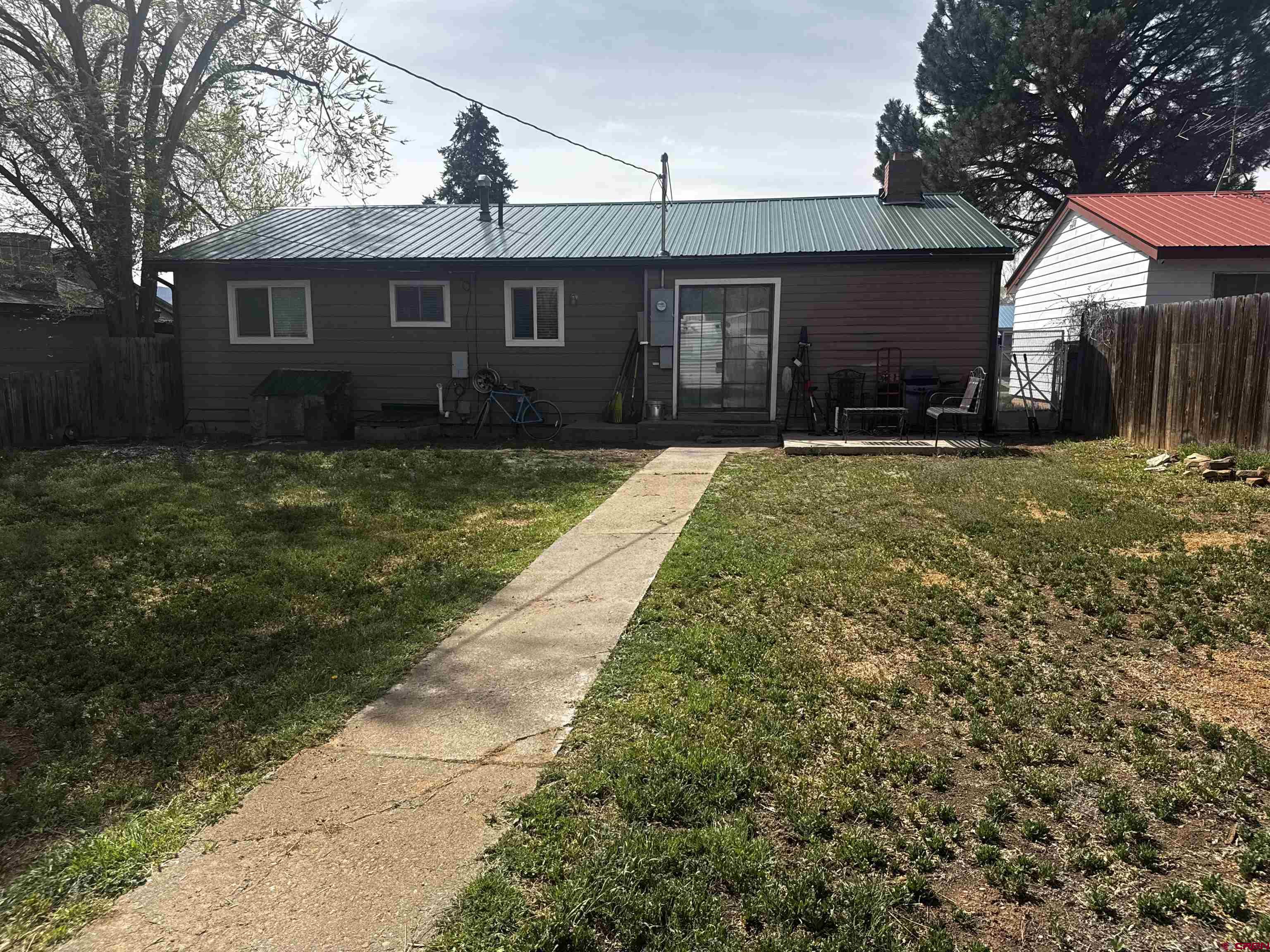 726 East 3rd Street Cortez, CO 81321 - Photo 18 of 20 a front view of a house with a yard