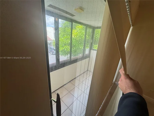 a view of an entryway with a floor to ceiling window