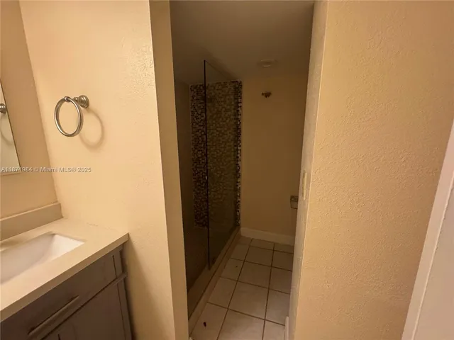 a bathroom with a sink and a shower