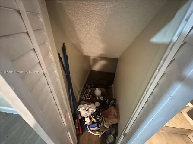 a view of a hallway with seating area