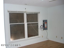 1245 Salter Path Road Atlantic Beach, NC 28512 - Photo 25 of 35 Master Bedroom-boarded windows