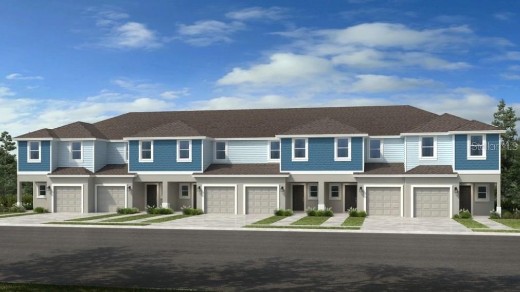 10705 Eclipse Street Sarasota, FL 34241 - Photo 1 of 1 a front view of a residential apartment building with a yard