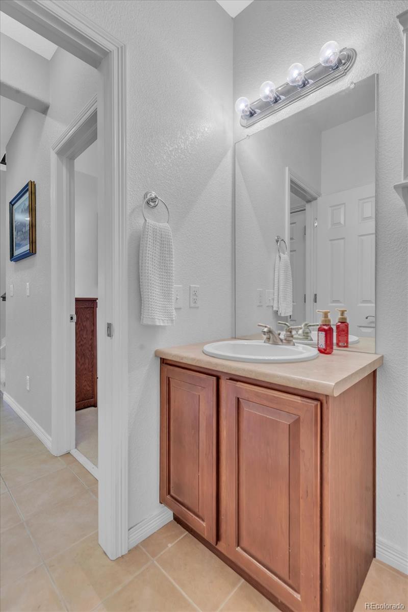 4786 Rabbit Mountain Road Broomfield, CO 80020 - Photo 31 of 41 a bathroom with a sink and a mirror
