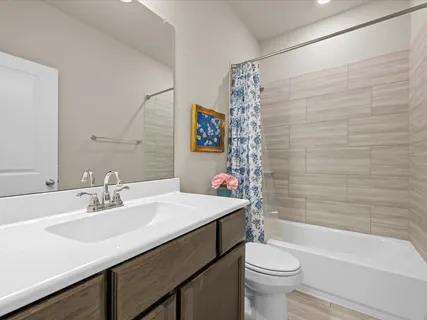 a bathroom with a sink a toilet and a bathtub