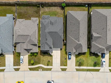 an aerial view of a house with swimming pool